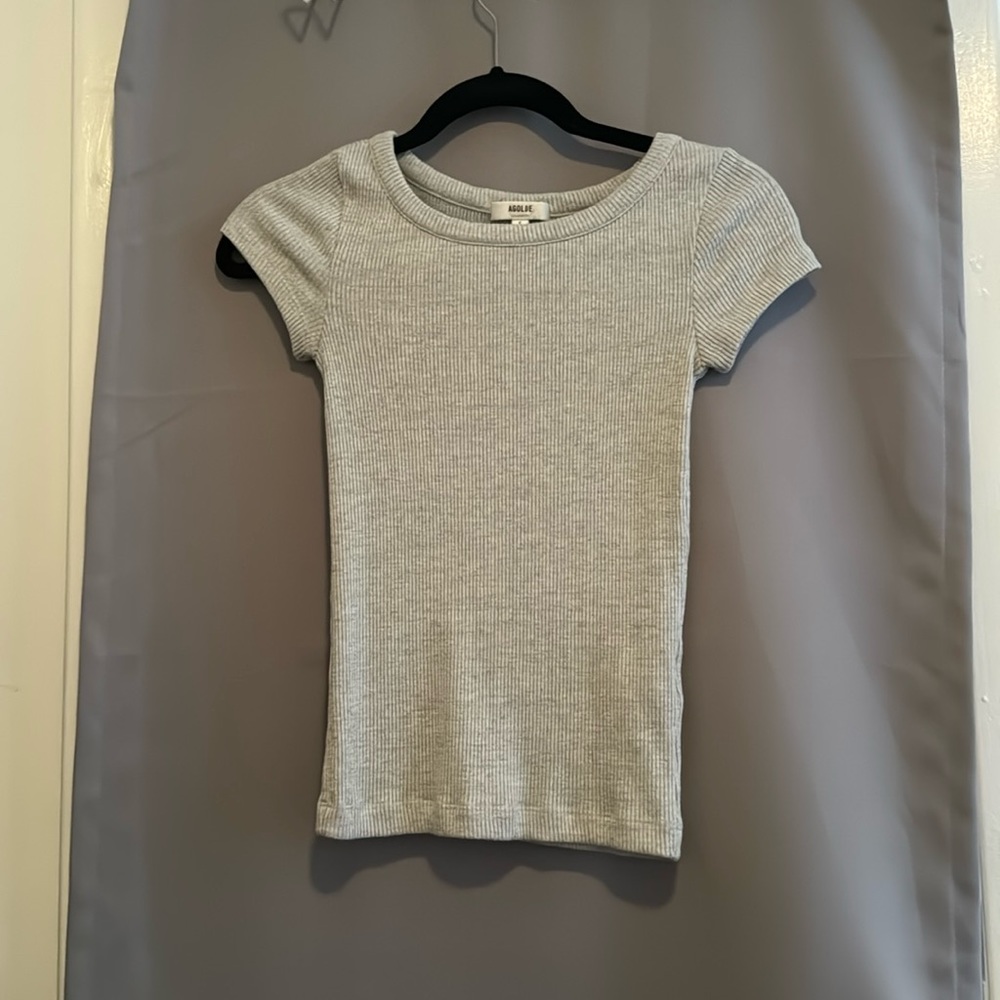Grey short sleeve top.
